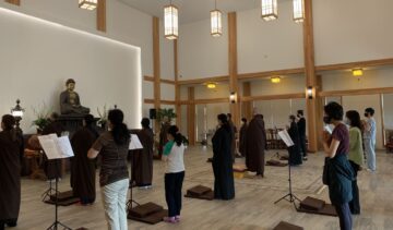 Meditation session with a Buddha statue