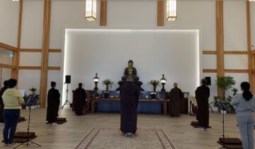 People meditating in a Buddhist temple