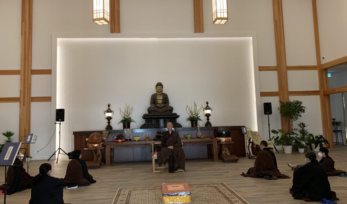 People meditating in serene temple setting