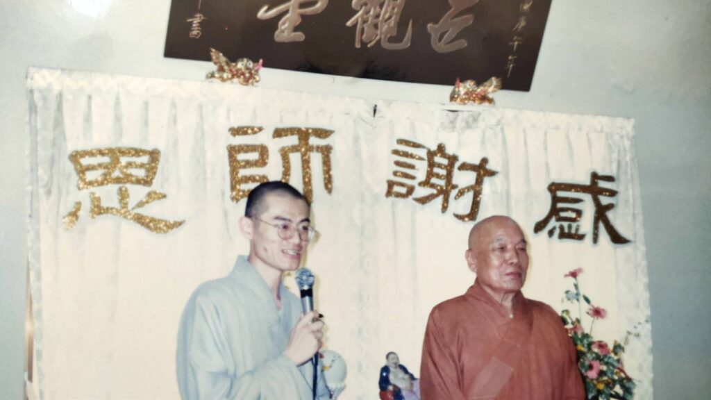 Monks speaking at an event